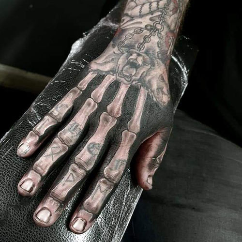 Grey Ink Finger Skeleton Hand Tattoo