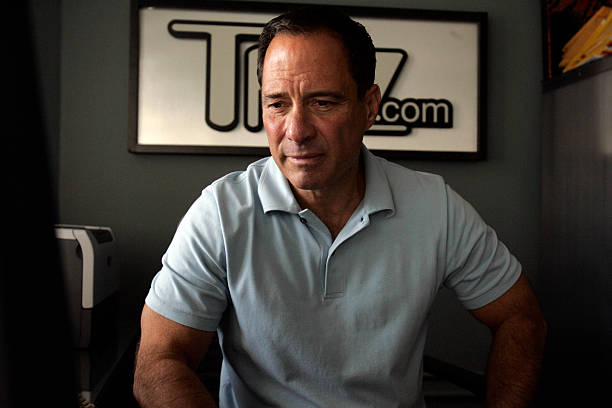 Harvey Levin Net Worth looks at his computer screen in his office at TMZ.com in Glendale.